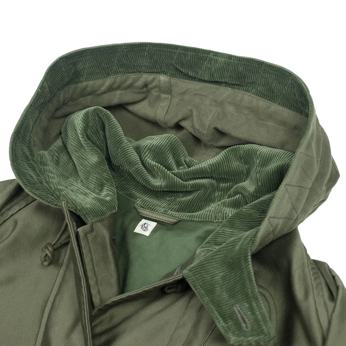 "Cold Weather Coat" oversized parka in field green cotton twill with corduroy trim